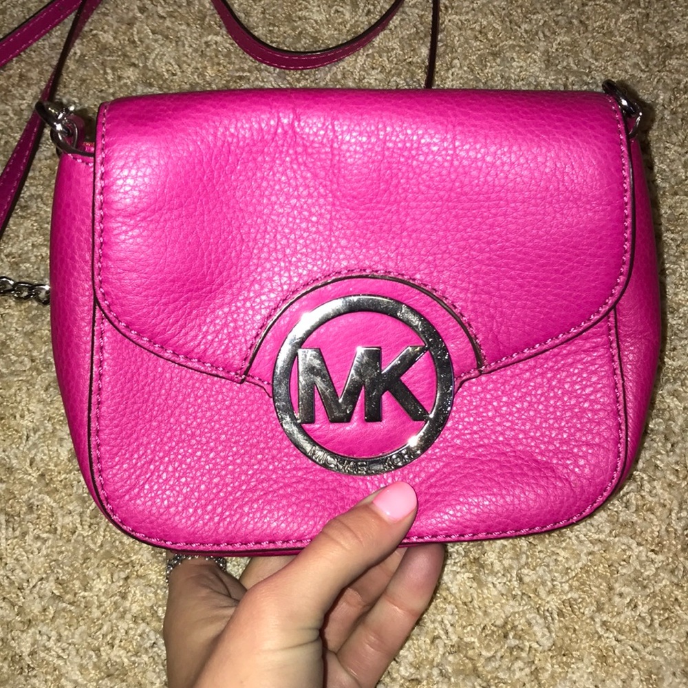 Pink Micheal Kors over the shoulder bag
